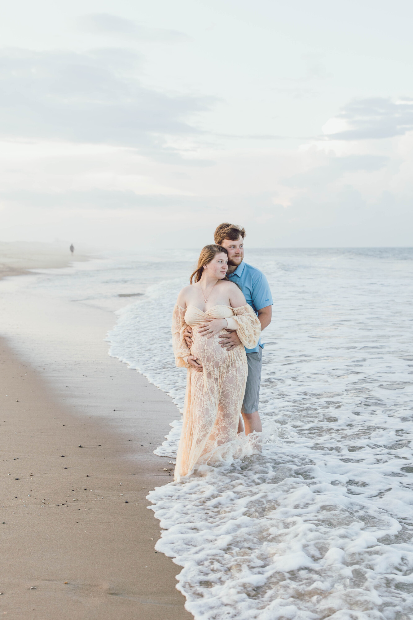 Couple portrait on Bethany Beach at sunset
