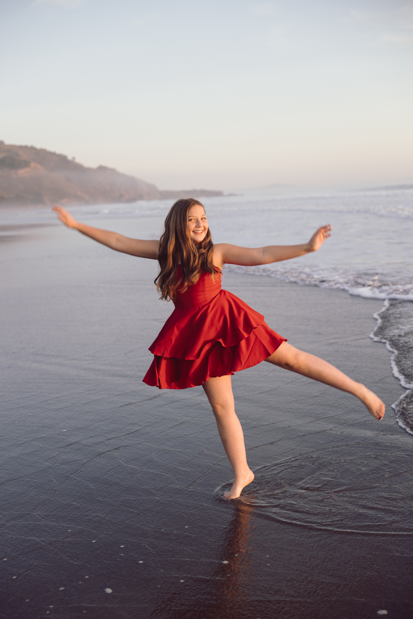 Playful ocean portrait during Bethany Beach family session