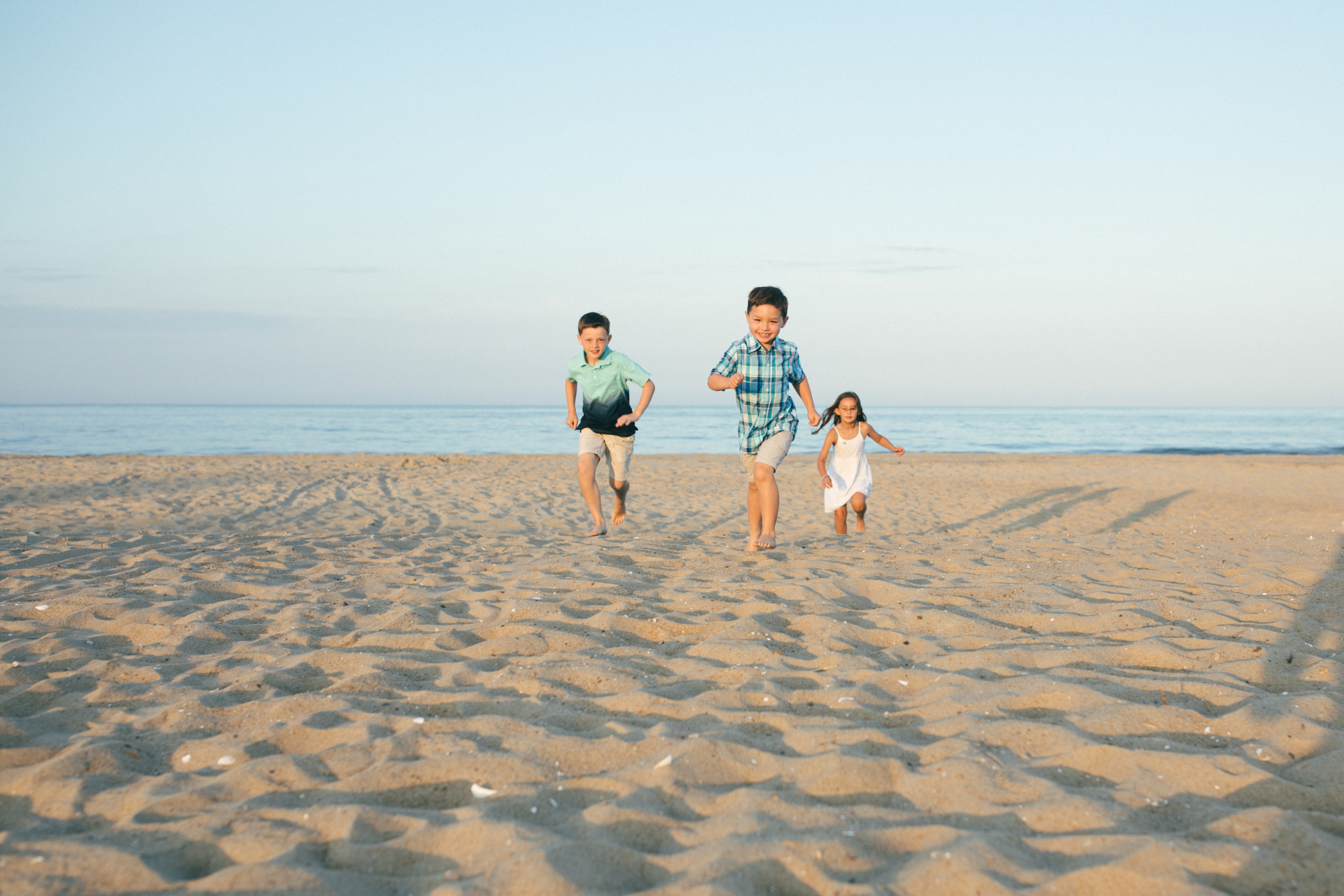 Family at sunset on Bethany Beach Delaware